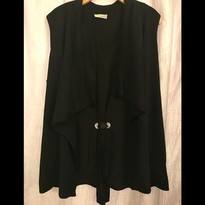 Sleeveless duster, grosgrain bow design in back.